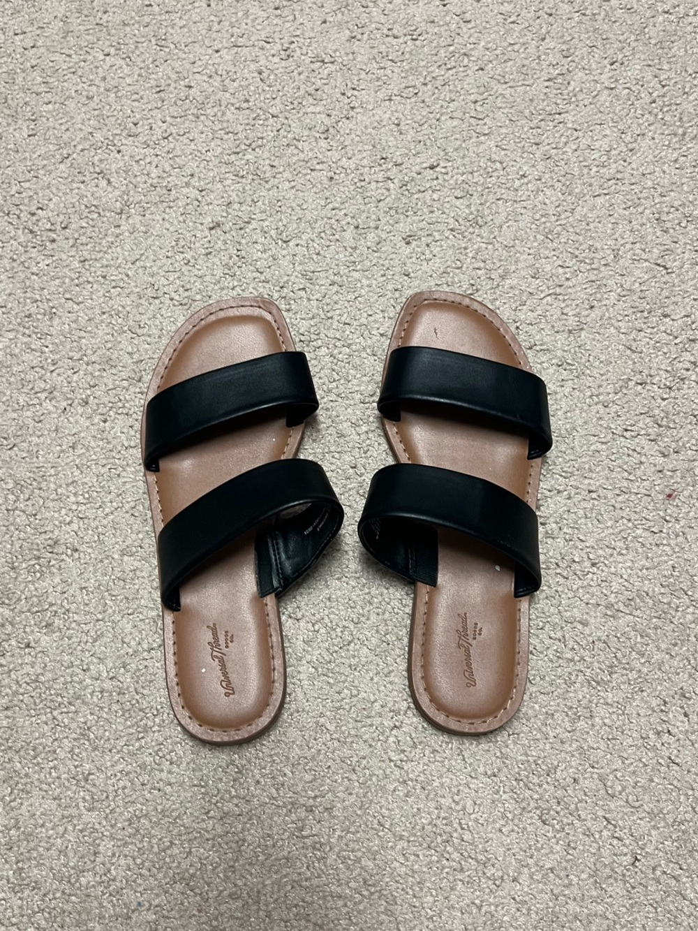Black and tan faux leather sandal flats with two straps